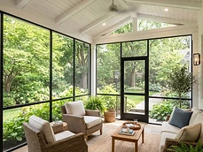 Screened porch showing quality Covered Deck Construction with a vaulted white ceiling in Colts Neck, NJ