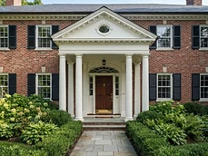 Classic brick colonial home showing quality exterior carpentry and a front entryway in Bradley Beach, NJ.