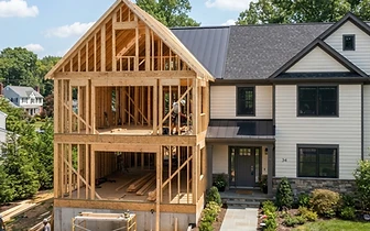 Exterior framing of multi-story Home Additions project under construction at a residential property in Deal, NJ.