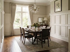 Dining room with extensive wall paneling completed by our Residential Carpentry team in Colts Neck, NJ.