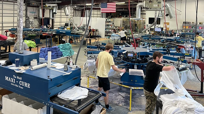 Seaside Silk Screening screen-printing production floor with M&R presses and dryer