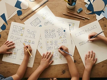 Kids working together on paper worksheets
