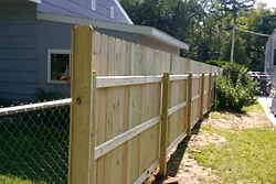 Pressure-treated wood privacy fence built by All Aspects in Sault Ste. Marie, Michigan