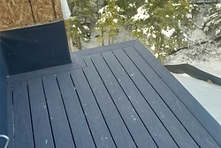 Newly installed dark grey composite deck by All Aspects