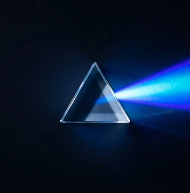 Glass prism refracting electric blue light