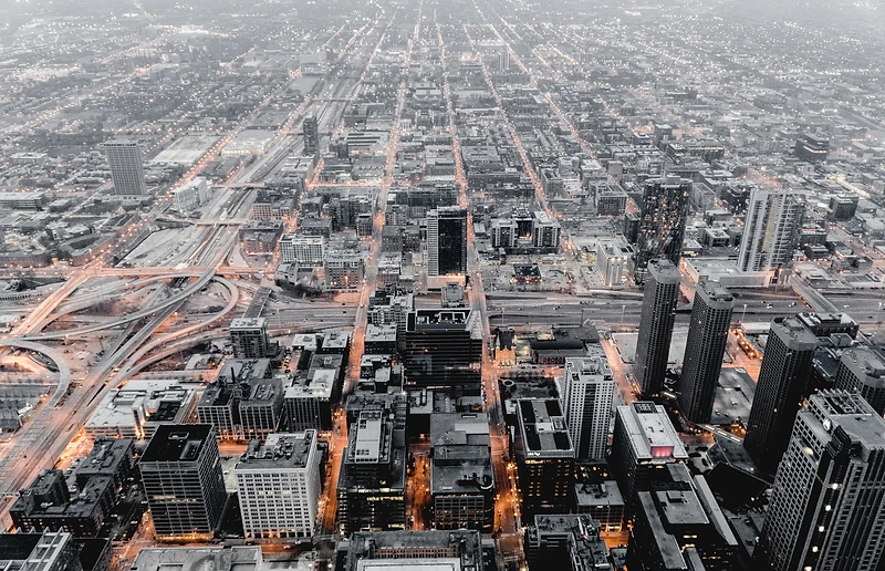 Aerial night cityscape with grid street lights