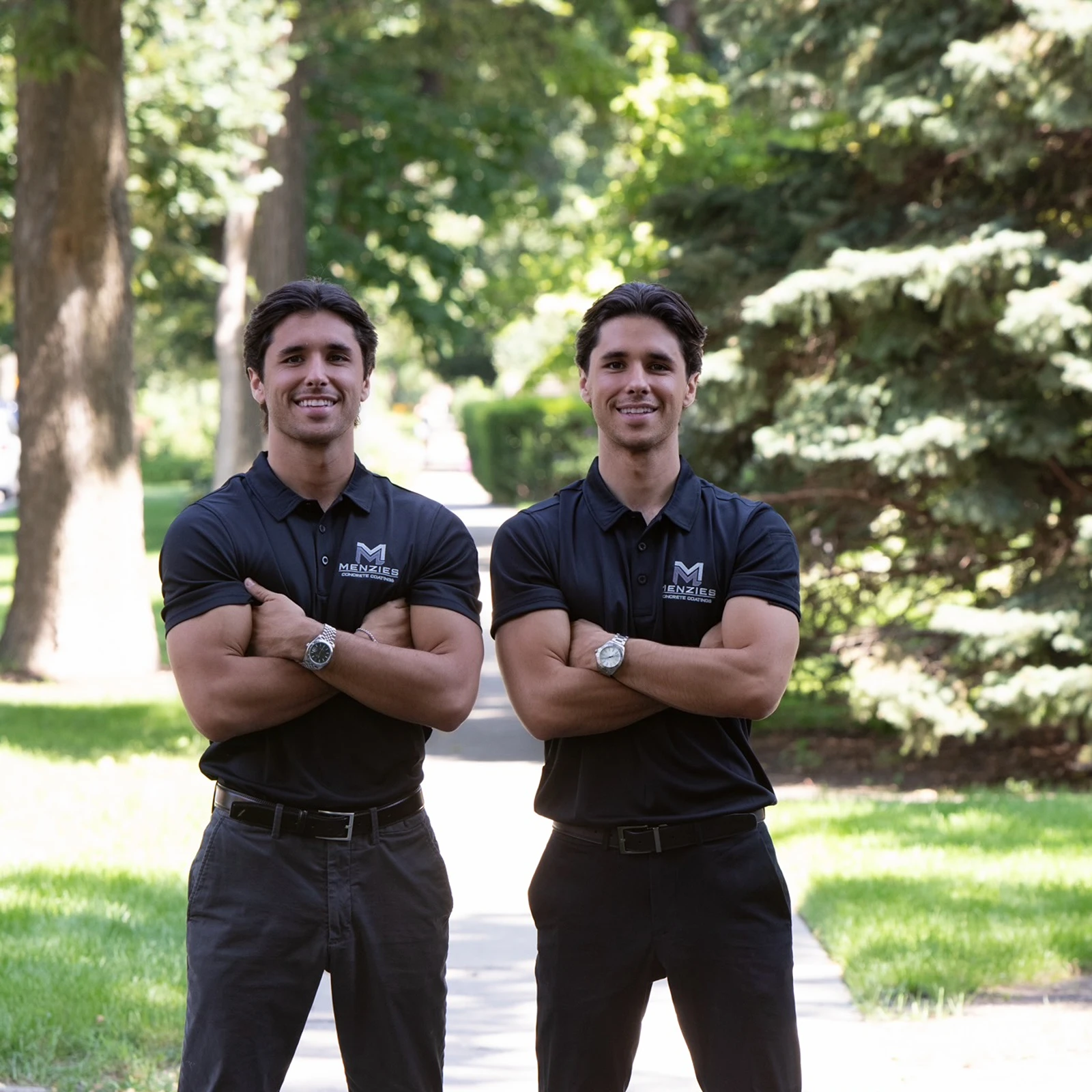 Sam and John Menzies standing in a high-gloss polyaspartic-coated garage