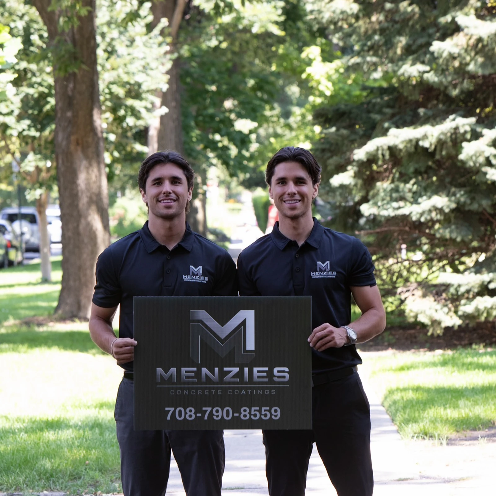 Sam and John Menzies in front of their Menzies Concrete Coatings branded truck