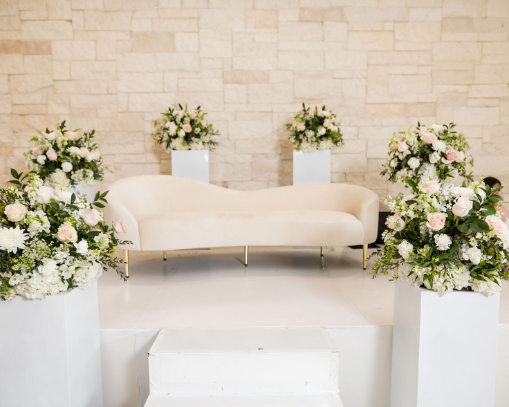Elegant wedding stage with floral arrangements