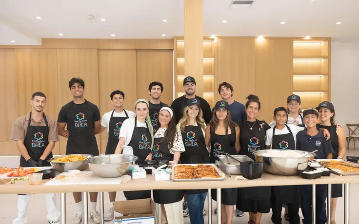 Beit Hachesed volunteers gathered in the community kitchen