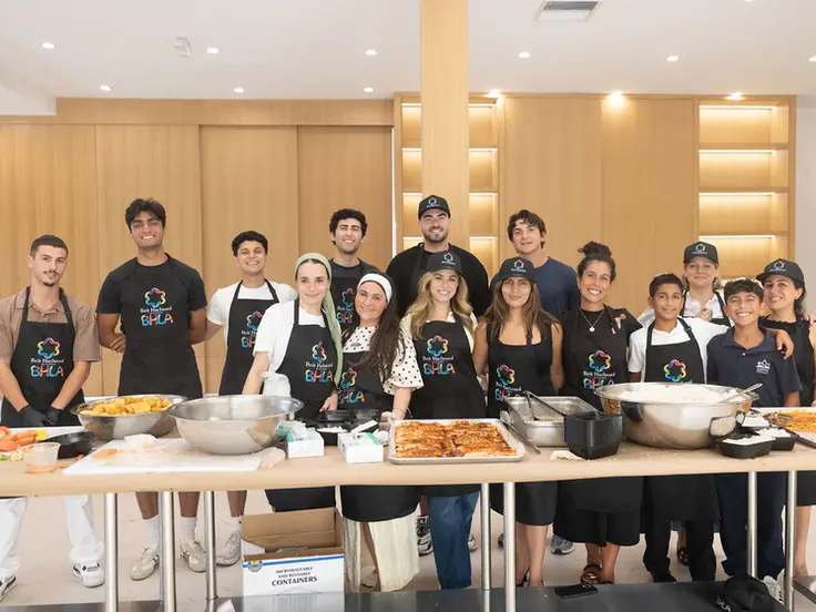 Beit Hachesed volunteers gathered in the community kitchen