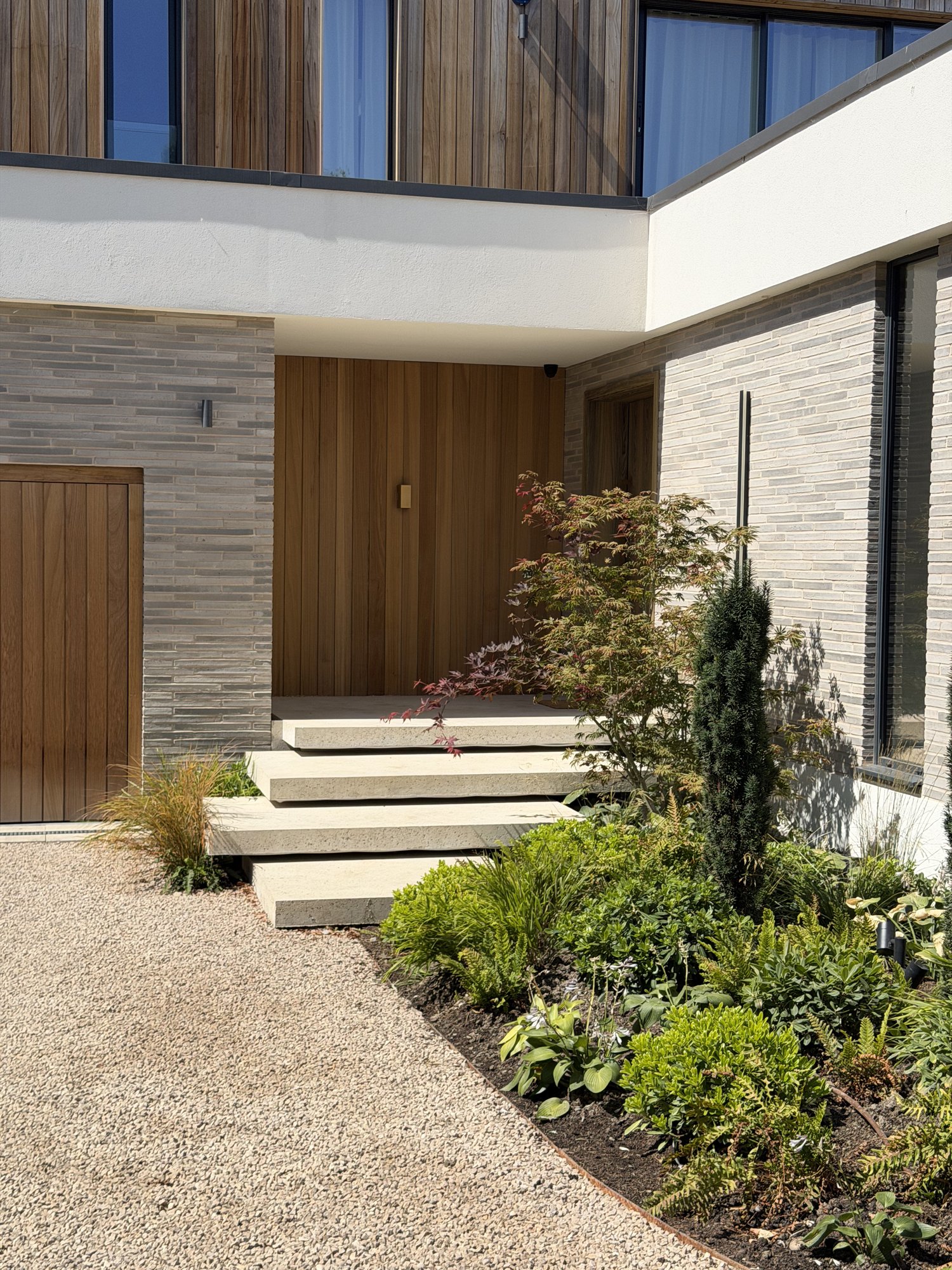 Entrance, timber doors and gravel