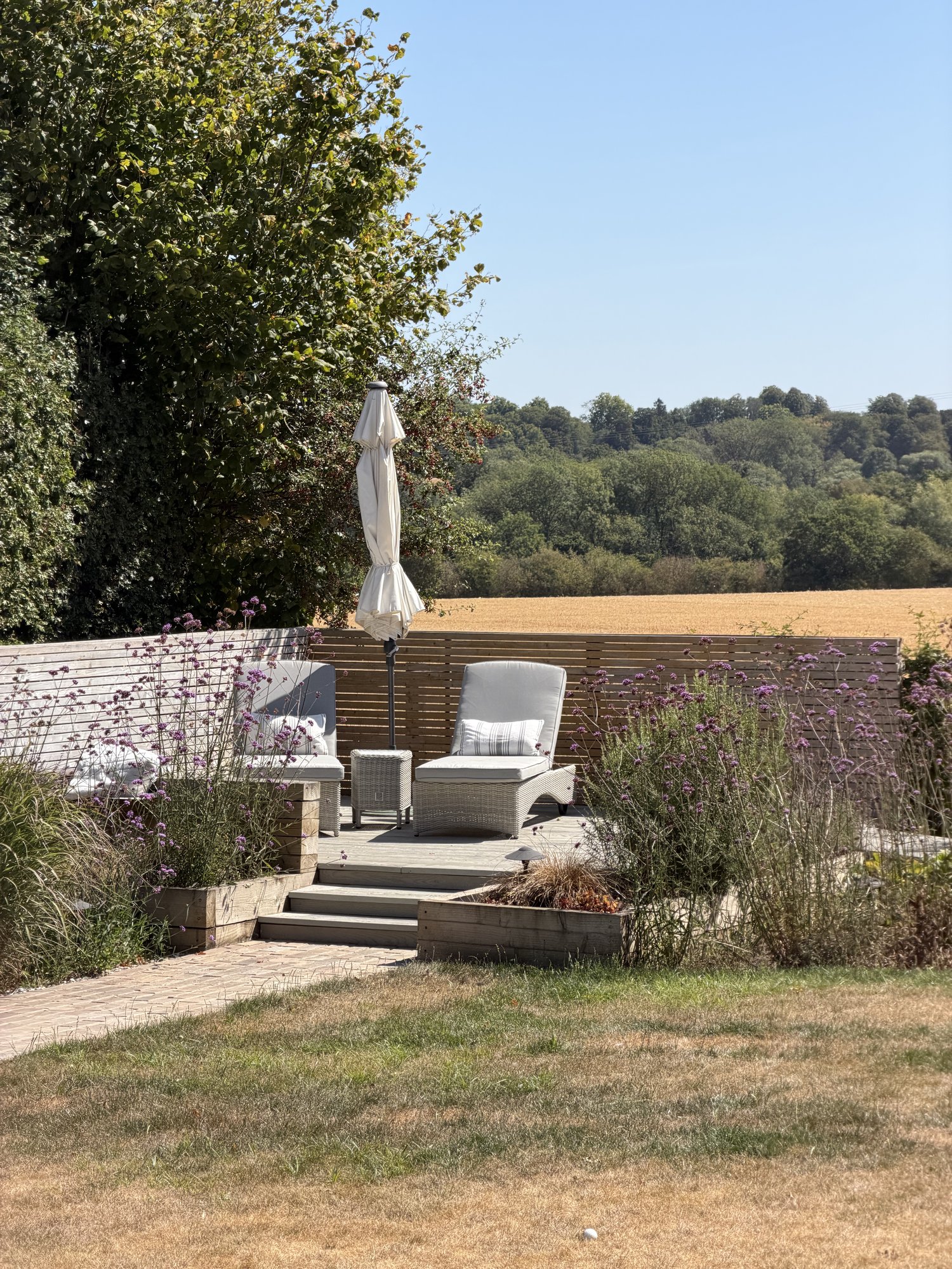 Chaise lounges under the parasol