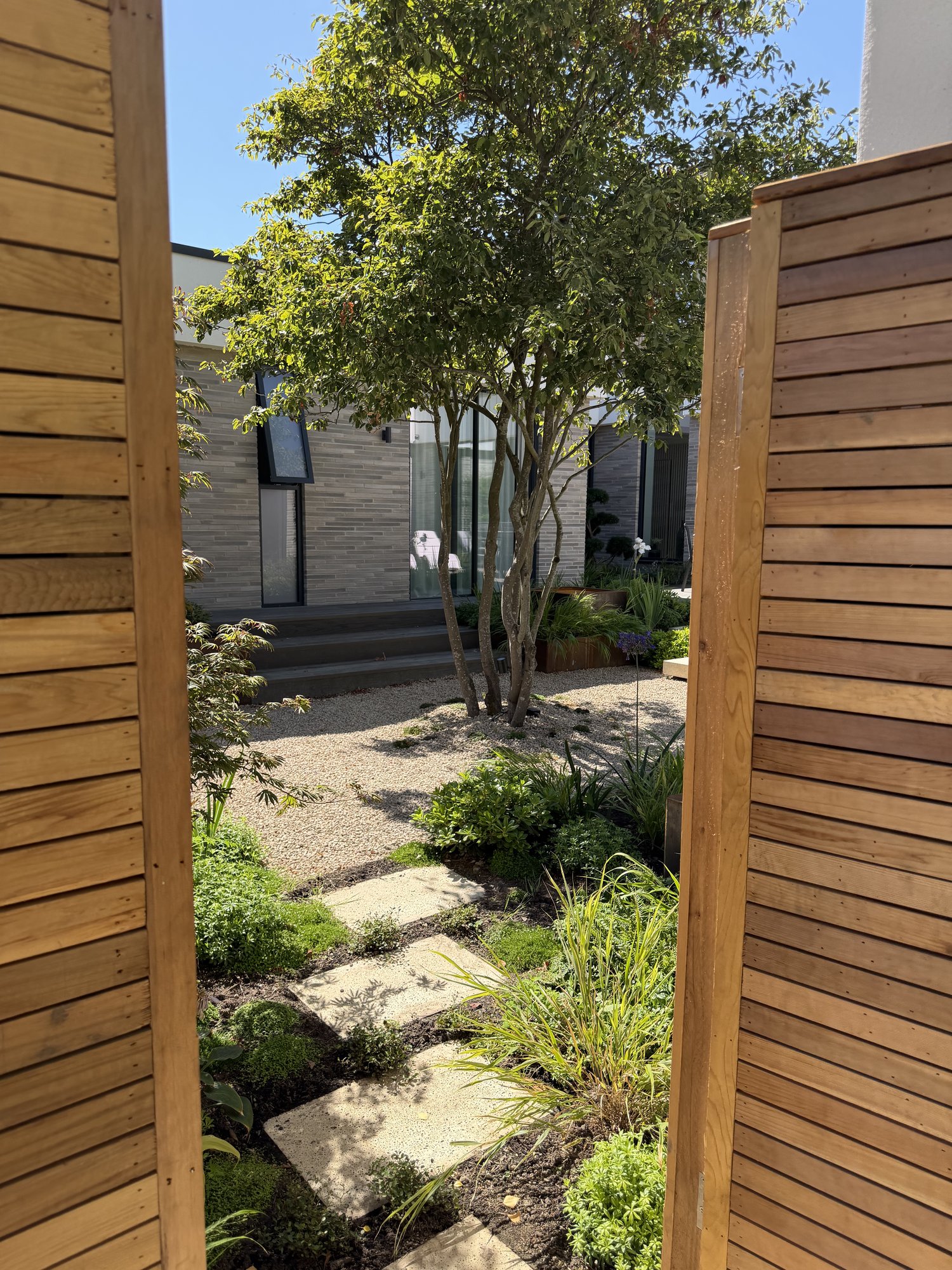 Through the slatted gateway to the house