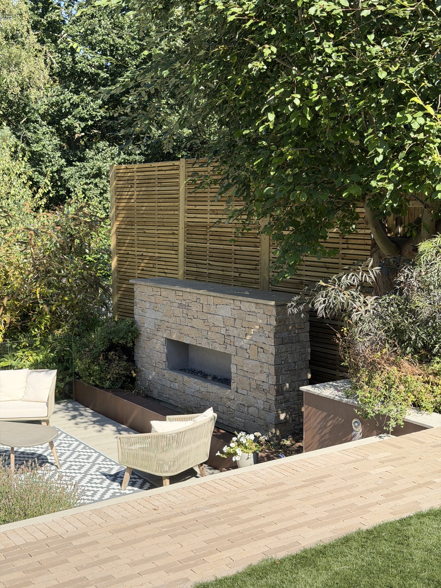 Stone fireplace and lounge terrace