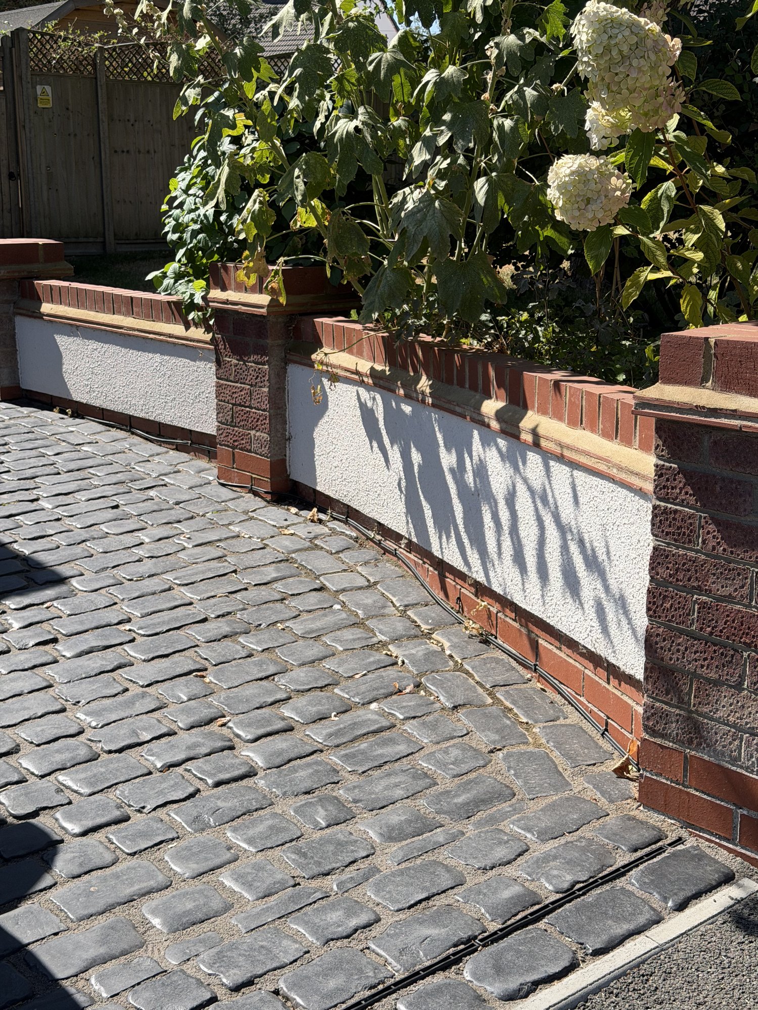 Brick pillars and rendered panels