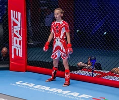 AVT girl raises England flag — IMMAF Youth World Champion