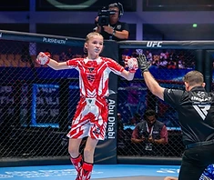 AVT girl holds England flag — IMMAF Worlds champion