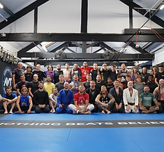 AVT team photo on the mats