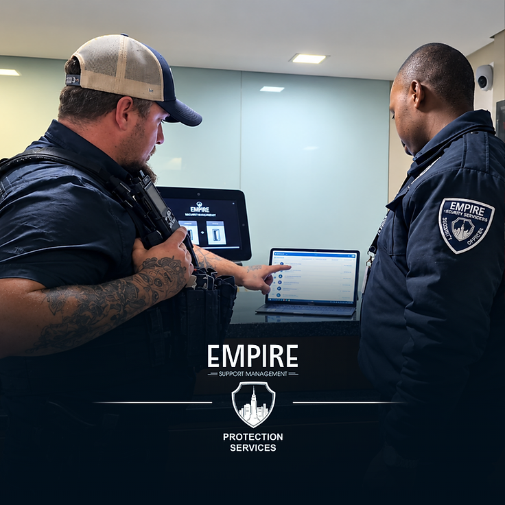 Empire security officers reviewing live site reports on the EMR system at a reception desk in Cape Town