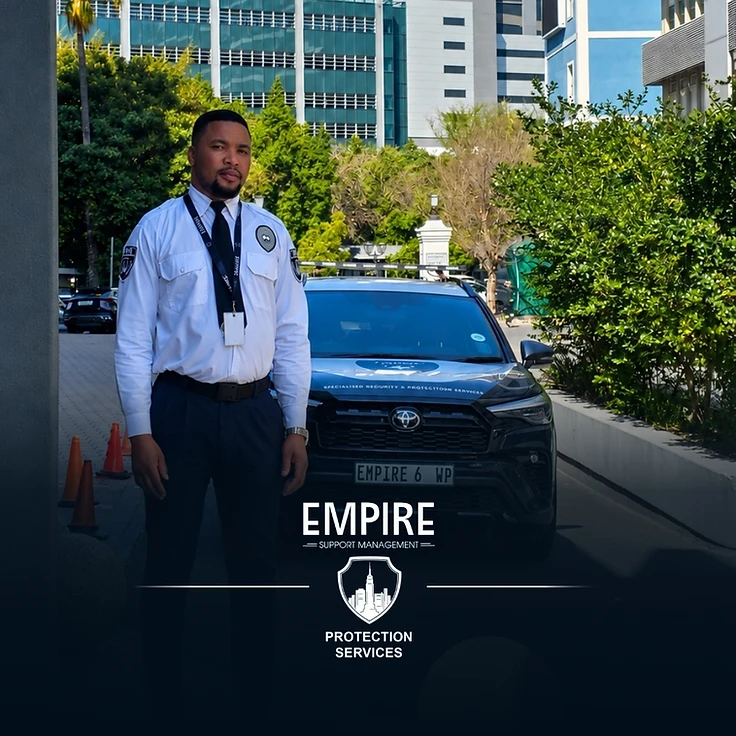 Empire security officer standing with a branded vehicle at a residential estate driveway