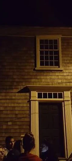 The tour gathers outside a historic Edgartown home