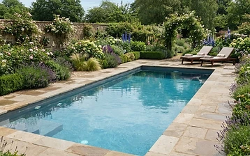 Newly built concrete swimming pool in a landscaped English garden