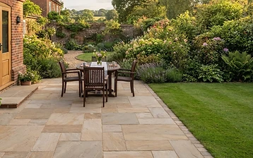 Newly laid sandstone patio in a landscaped Surrey garden