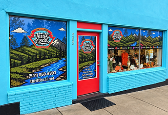 Turquoise Thrift Local storefront with a red door on Main Street in Myrtle Creek, Oregon