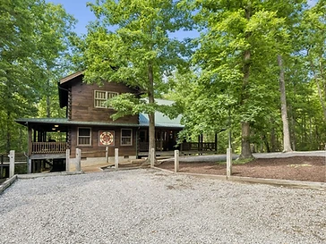 Honeycutt Hollow cabin exterior nestled in the forest