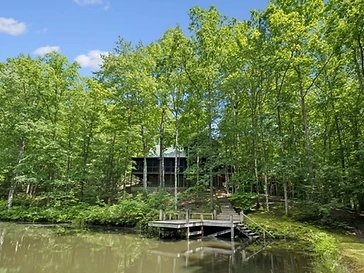 Cabin overlooking the pond with boat dock