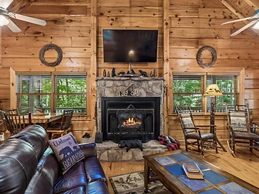 Stone fireplace with mounted TV and rustic decor
