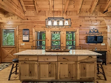 Kitchen island with granite countertop and pendant lights