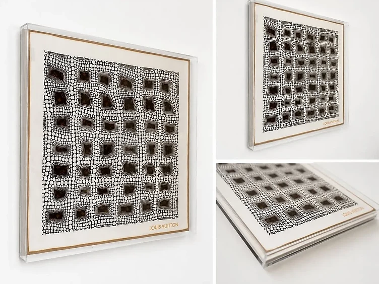 A Louis Vuitton polka-dot silk textile float-mounted in a clear acrylic shadow box, shown from three angles on a white wall