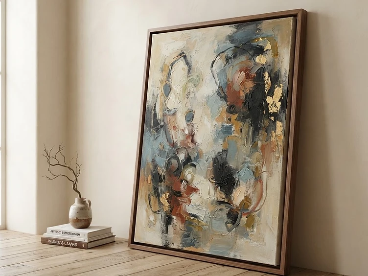 Contemporary abstract canvas painting in a walnut floater frame against a cream wall