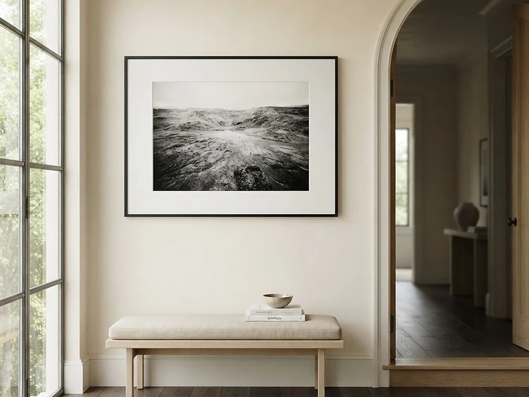 Large black-and-white photograph in a slim black frame with a wide white archival mat