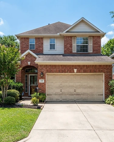 Original home photo before garage door replacement