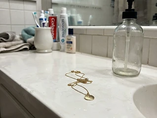 Original phone photo of the gold pendant necklace