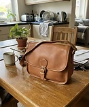 Original phone photo of a leather handbag