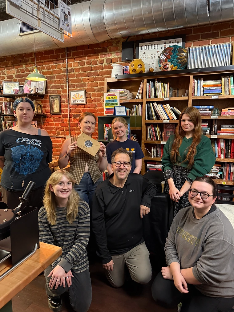 The Milena Chapter volunteers inside Abi's Books & Brews
