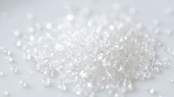 Macro photograph of sparkling brilliant white refined cane sugar ICUMSA 45 crystals