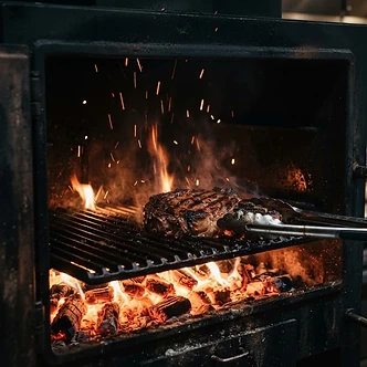 KOPA charcoal oven with glowing embers