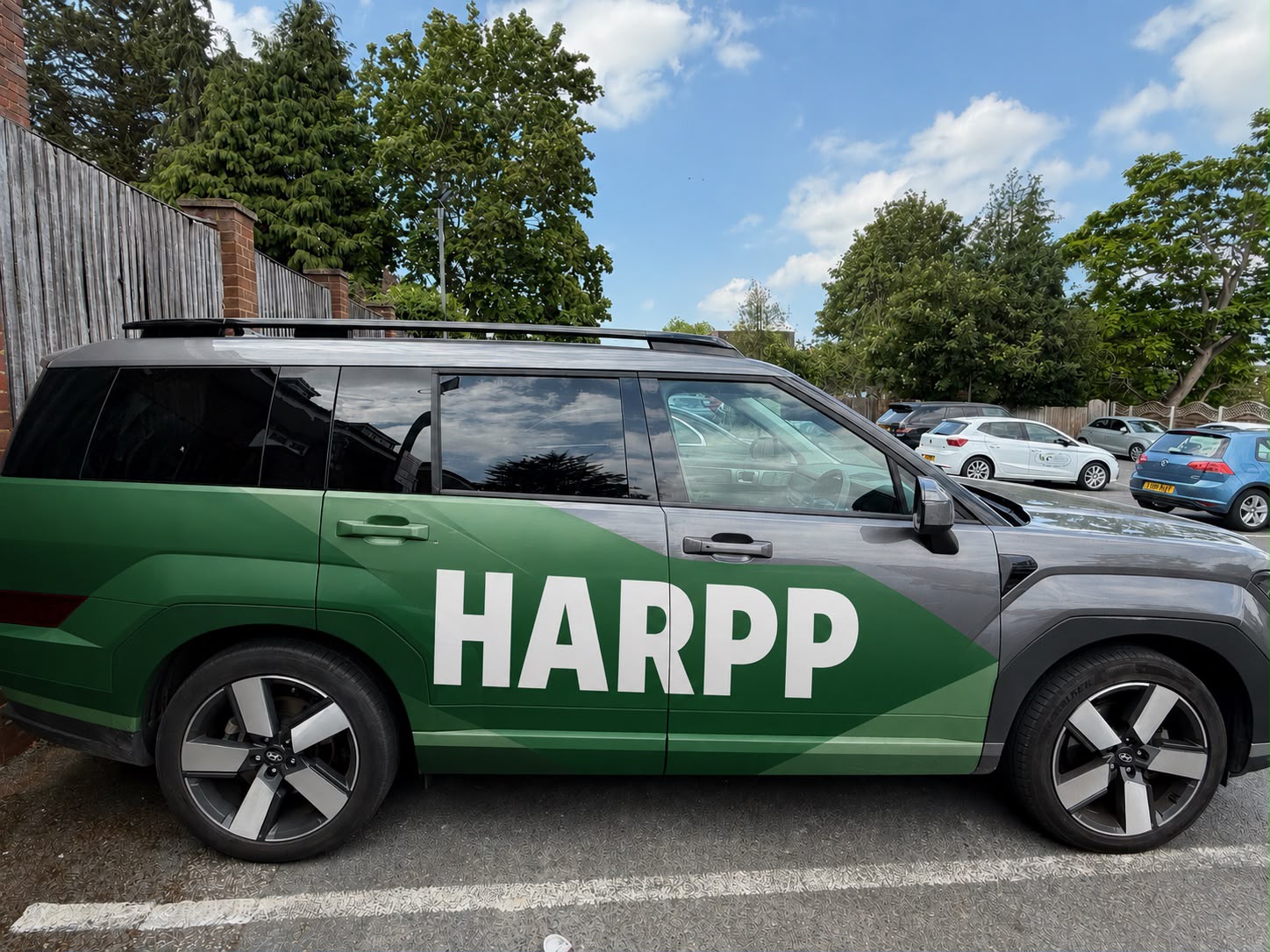 The HARPP car, wrapped in green with the HARPP wordmark