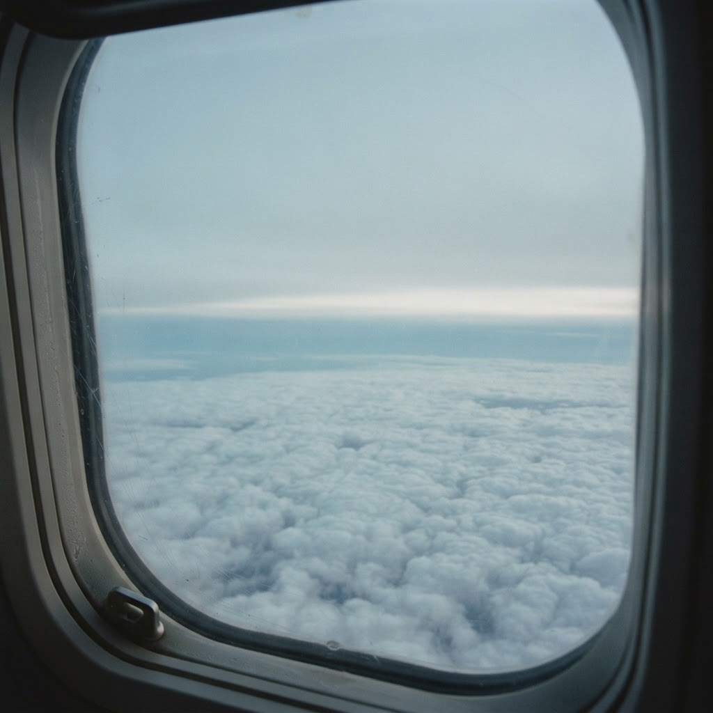 A detached view of a cloud layer from an aeroplane window