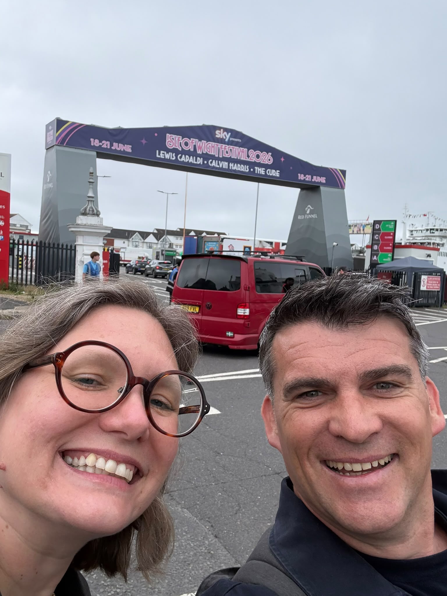 Two of the HARPP team under the Isle of Wight Festival entrance arch