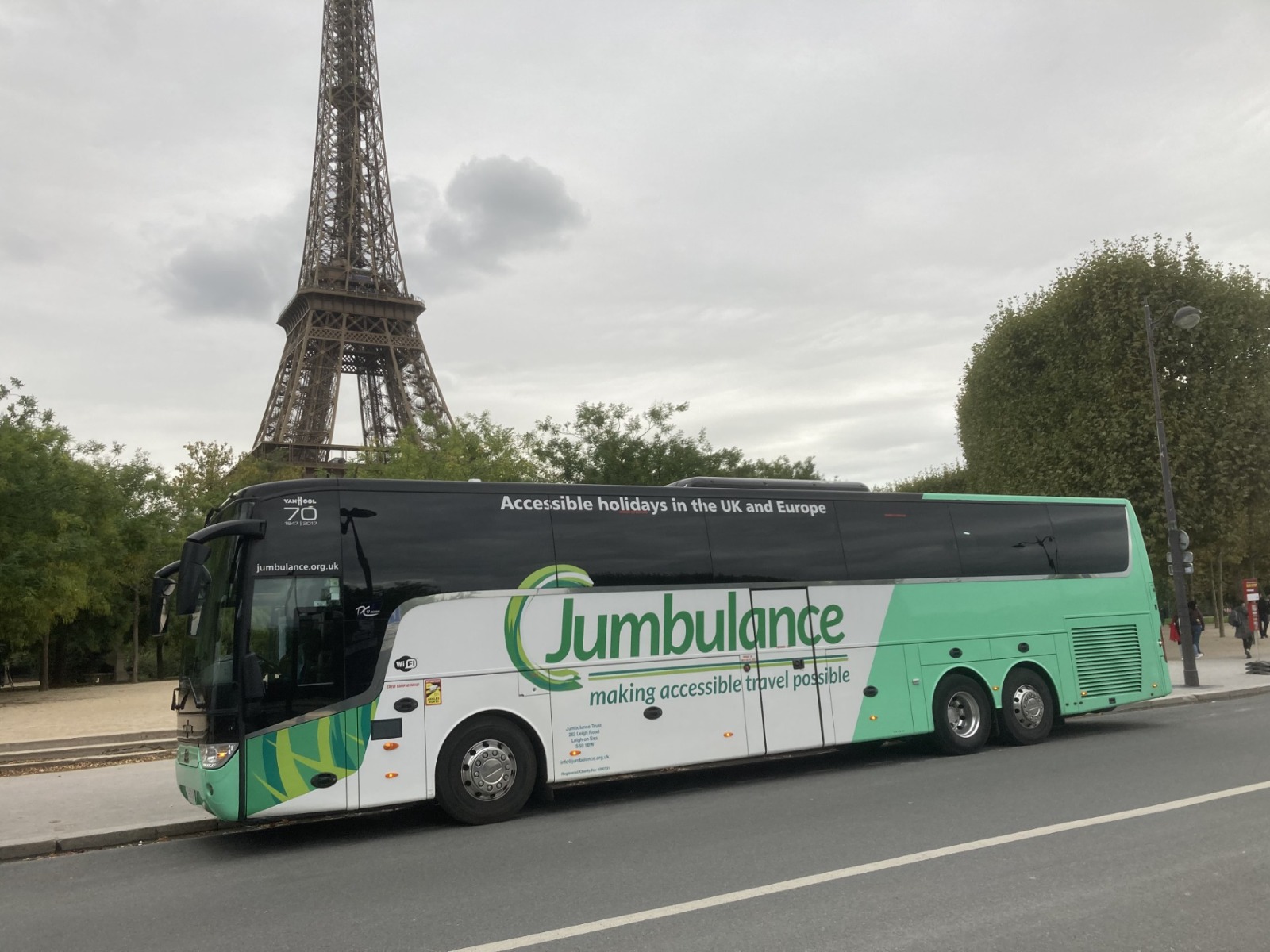 J3 Jumbulance coach parked in front of the Eiffel Tower in Paris