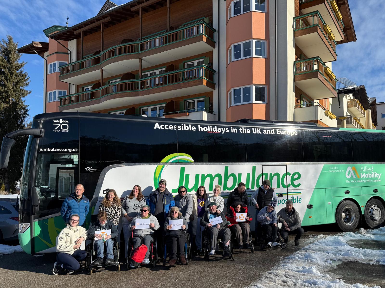 The group with the Jumbulance coach in the snow