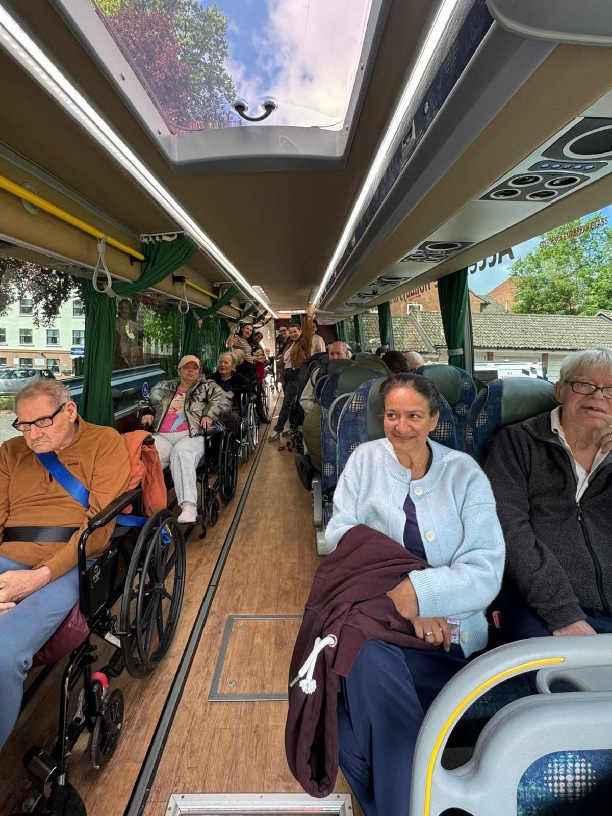 Travellers seated together in the Jumbulance cabin