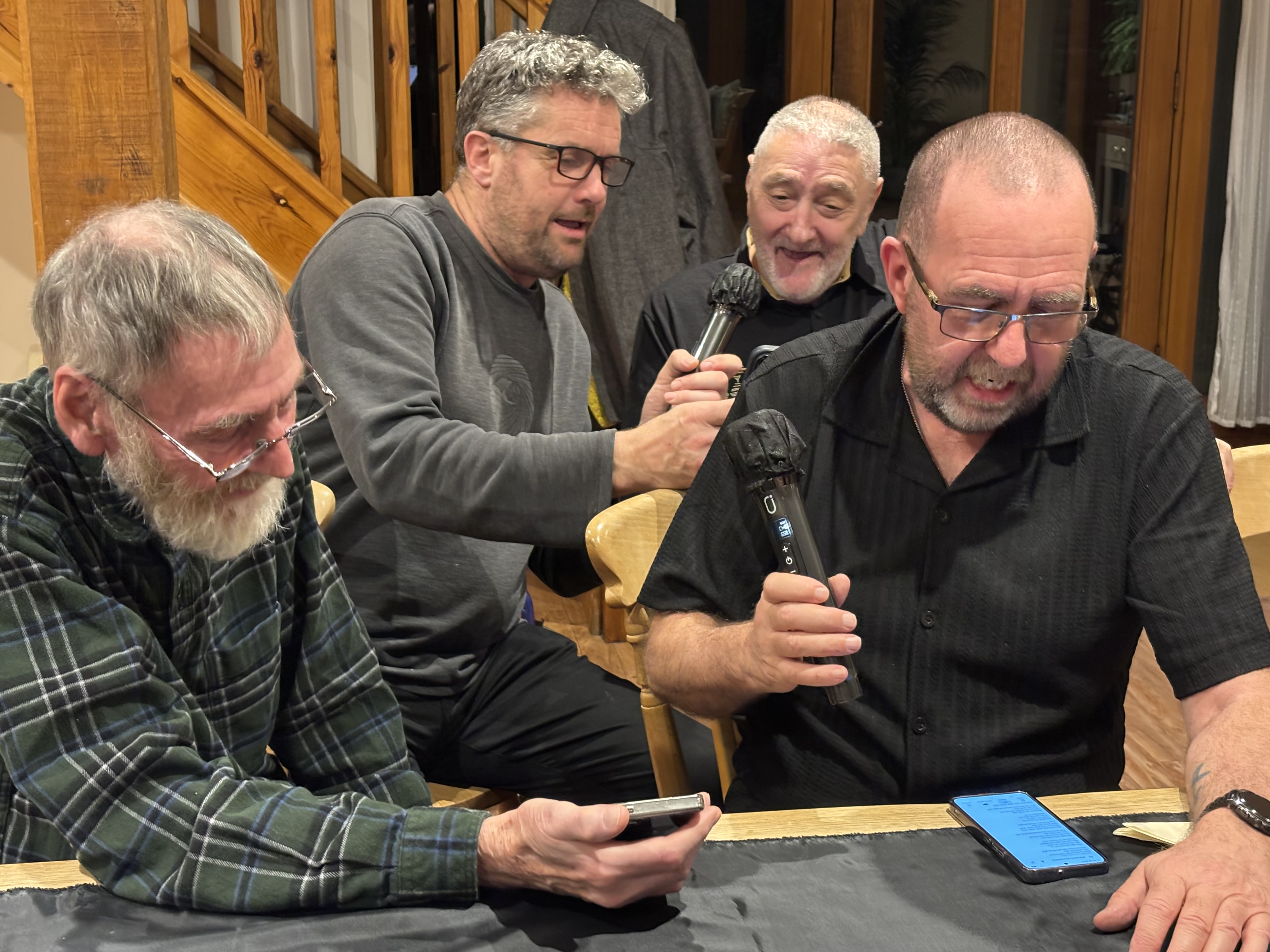 Volunteers singing together at a social evening