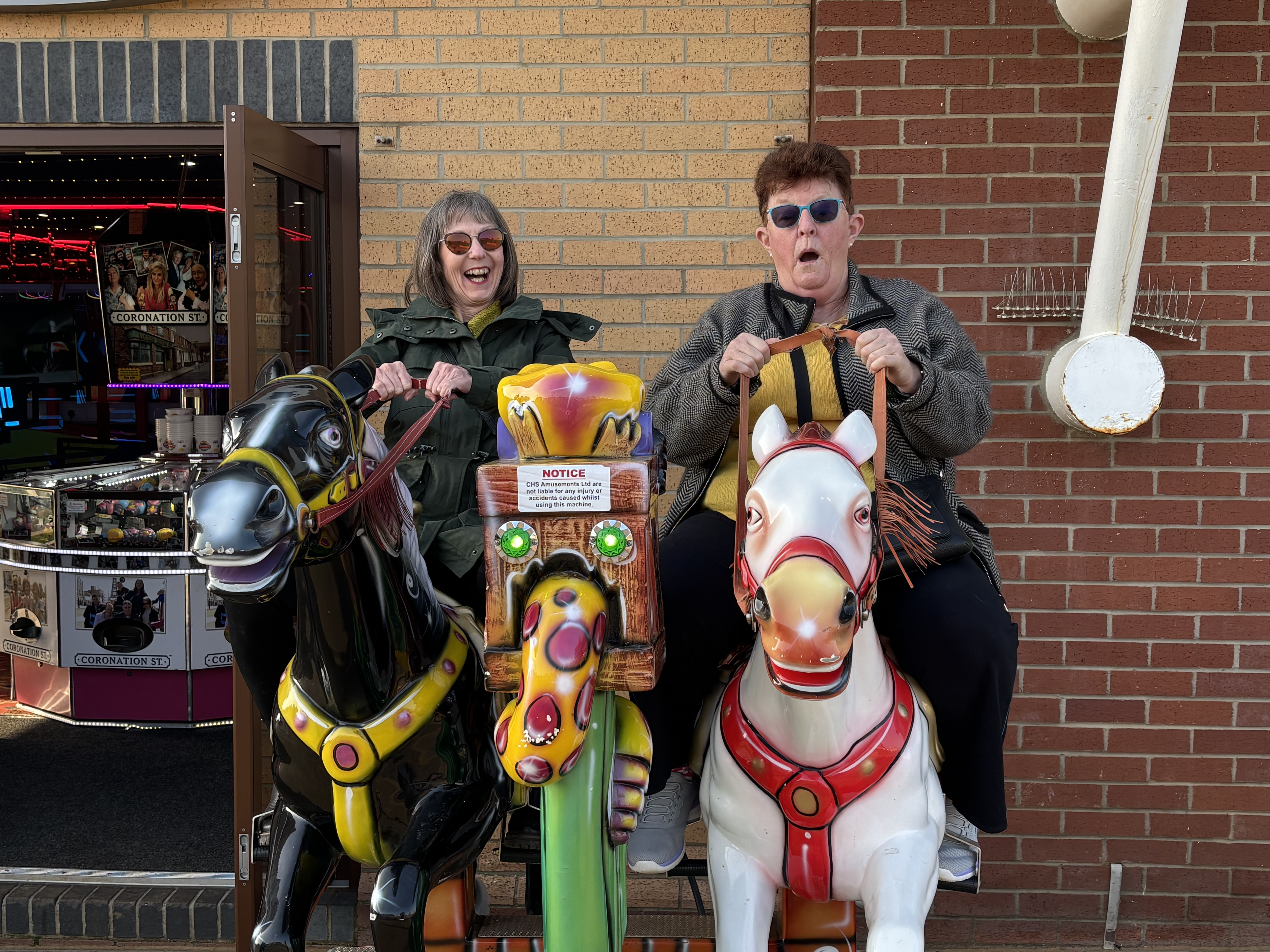 Two travellers enjoying a carousel ride